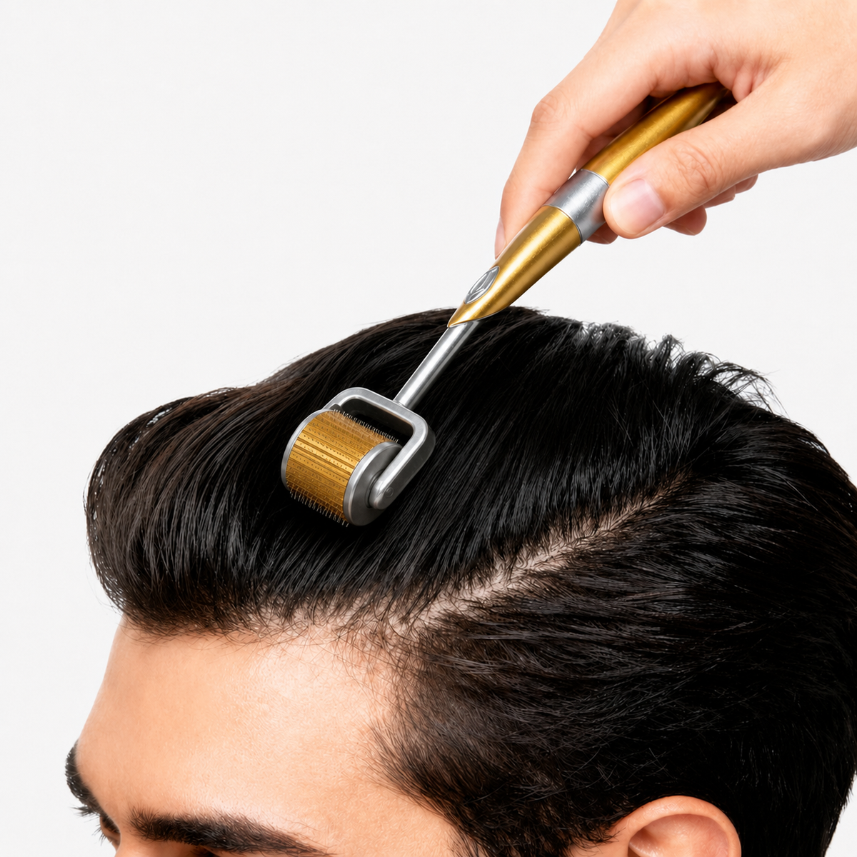 Gold-handled Reiland Beauty Products ZGTS derma roller being gently used on a man’s hair and scalp.