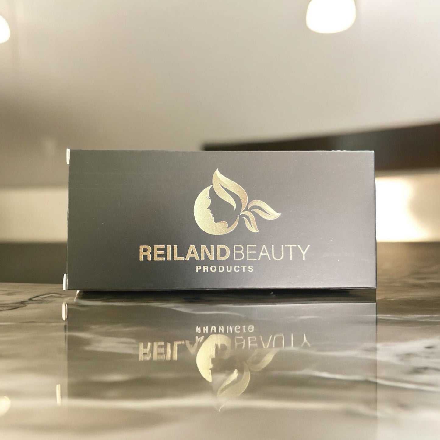 Luxury black packaging of Reiland Precision Brow Enhancer with gold logo