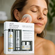 Middle-aged woman applying Reiland Age Reverse System with cotton pad, showcasing the complete anti-aging skincare set including cleanser, serum, and moisturizer. Clinically tested and dermatologist formulated.