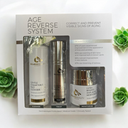 Reiland Beauty Age Reverse System photographed with green leaves, representing clean, dermatologist-formulated skincare for anti-aging and skin renewal.