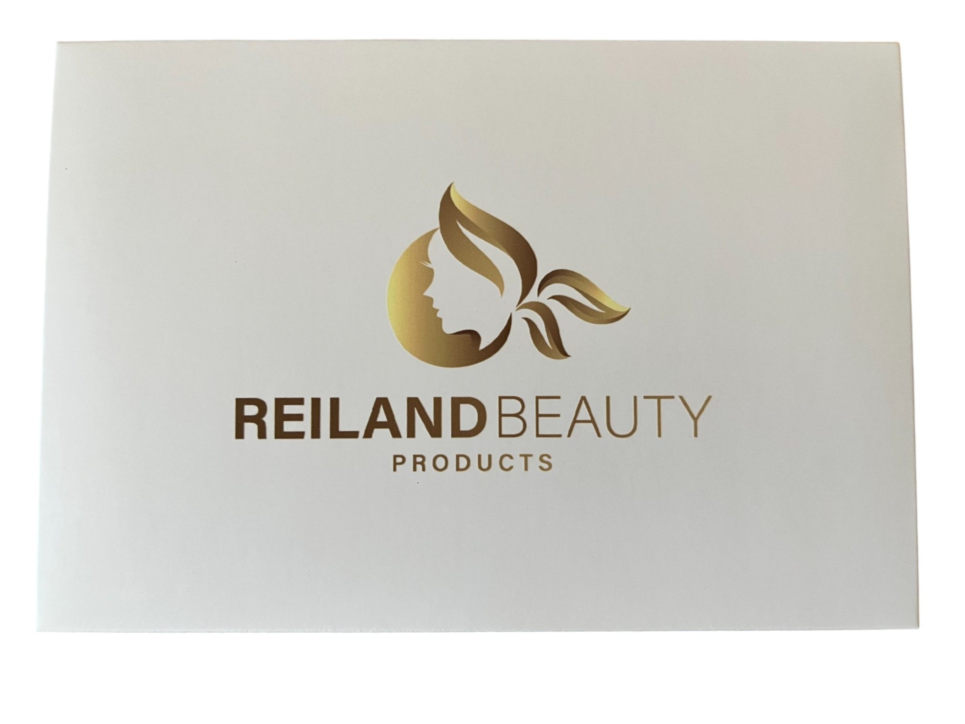 Top view of Reiland Beauty Products' Velvet Bloom eyeshadow palette packaging featuring the gold embossed logo on a sleek white background.