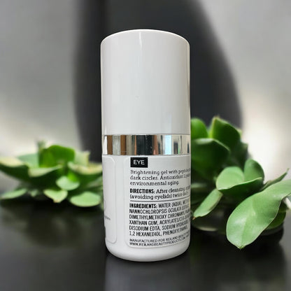 Back view of the Reiland Ultra Benefit Eye Gel showing detailed ingredients and usage directions with succulent plants in the background.