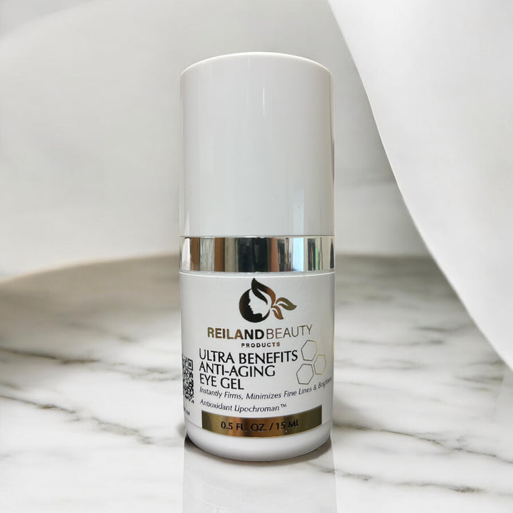 Reiland Ultra Benefit Anti-Aging Eye Gel placed on a luxurious marble surface with soft white draping, emphasizing elegance and clinical quality.