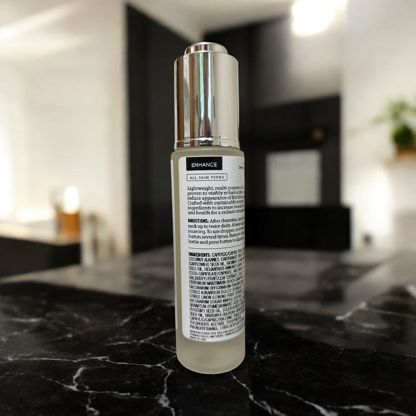 Back label view of Reiland Radiance Renewal Elixir displaying key ingredients and usage directions for a clinically proven, skin-renewing experience.