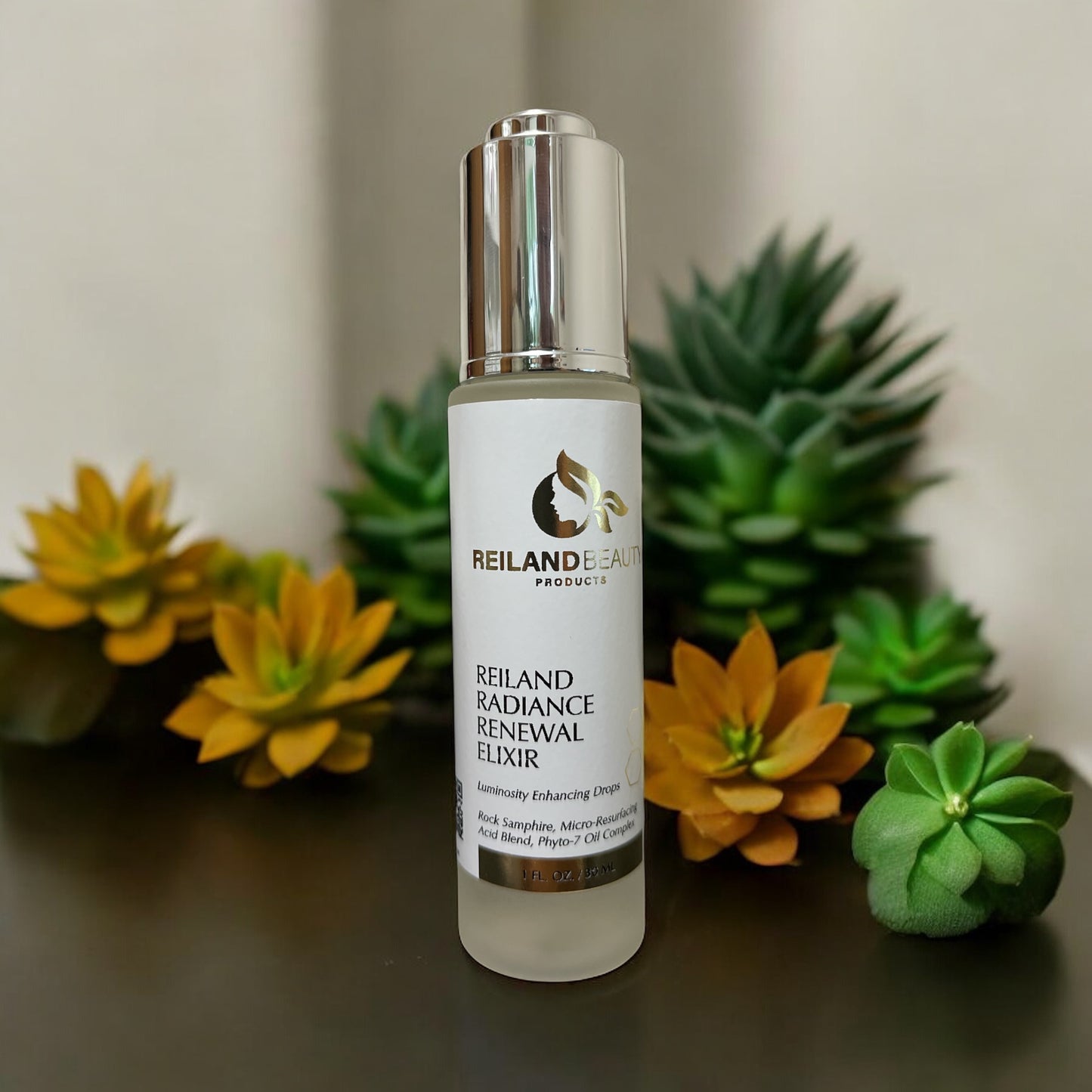 Reiland Radiance Renewal Elixir bottle styled with vibrant green and golden succulents, symbolizing the plant-based purity and soothing power of the elixir.