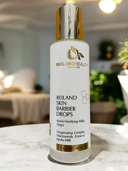 Reiland Skin Barrier Drops displayed on a luxury black rock with water ripples. A hydrating, oxygenating skincare serum infused with Niacinamide, Ectoin, and Jojoba Milk to strengthen the skin barrier, reduce redness, and enhance skin glow. Suitable for all skin types.