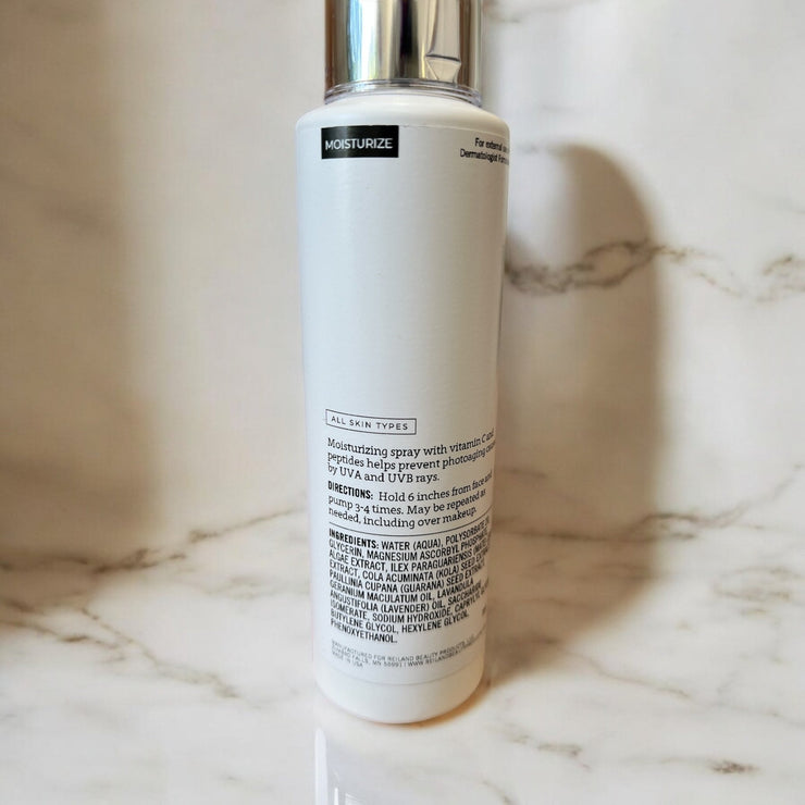 Back view of Reiland Vital-C Hydrating Mist bottle showing ingredients and usage directions – vitamin C facial mist for all skin types