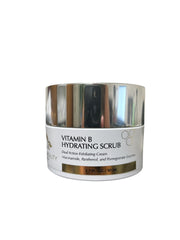 Front view of Reiland Vitamin B Hydrating Scrub with a shiny silver lid, showcasing label details including niacinamide, panthenol, and pomegranate enzymes on a clean white background.